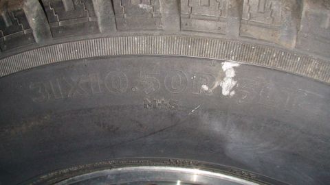 1979 Ford Bronco - The tire sidewall displays its size and M+S designation, indicating mud and snow capability.