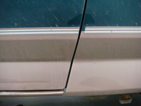 1996 Ford Bronco - Close-up of the side panel and door seam on a 1996 Ford Bronco.
