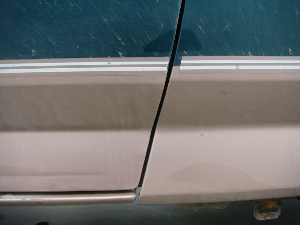 1996 Ford Bronco door seam with two-tone paint and pinstripes