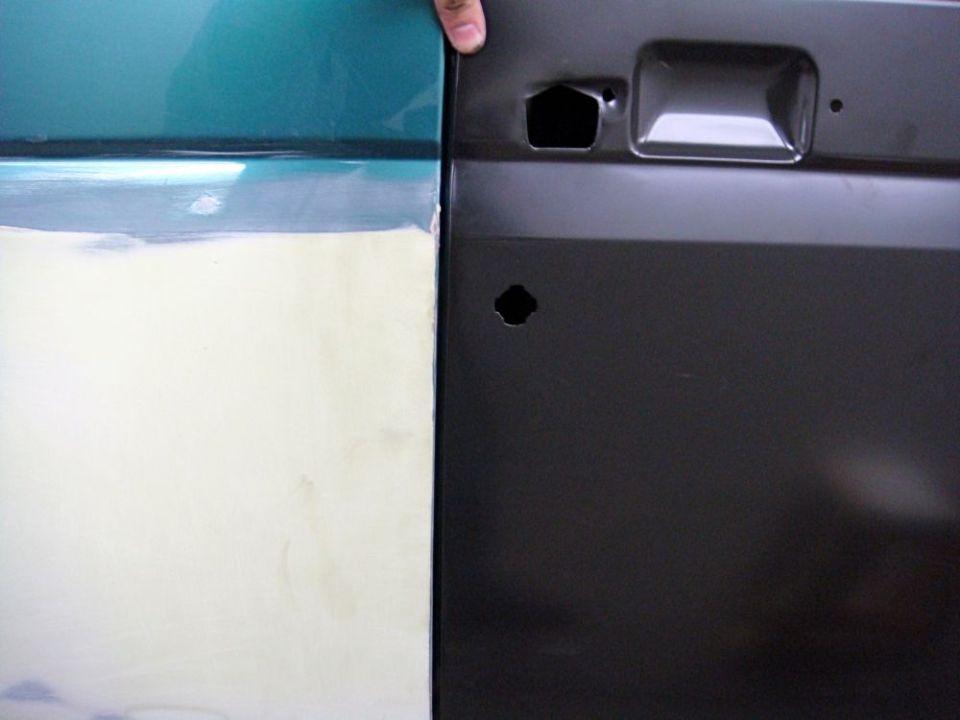 Close-up of two vehicle door panels, one green with body filler, the other black with a handle cutout