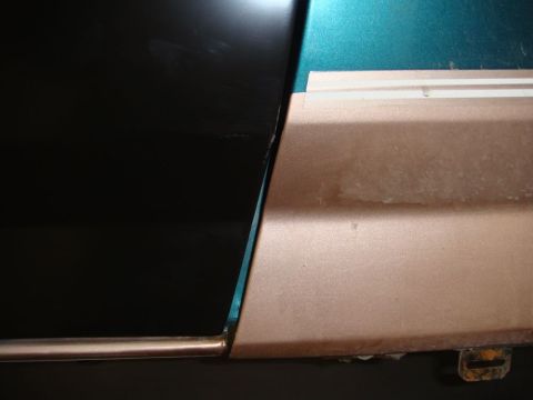 1996 Ford Bronco - Detail of a car door's edge and trim, showing the transition between different body panels.