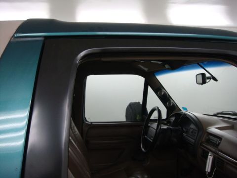 1996 Ford Bronco - Interior view of a 1996 Ford Bronco, highlighting the dashboard and seating area.