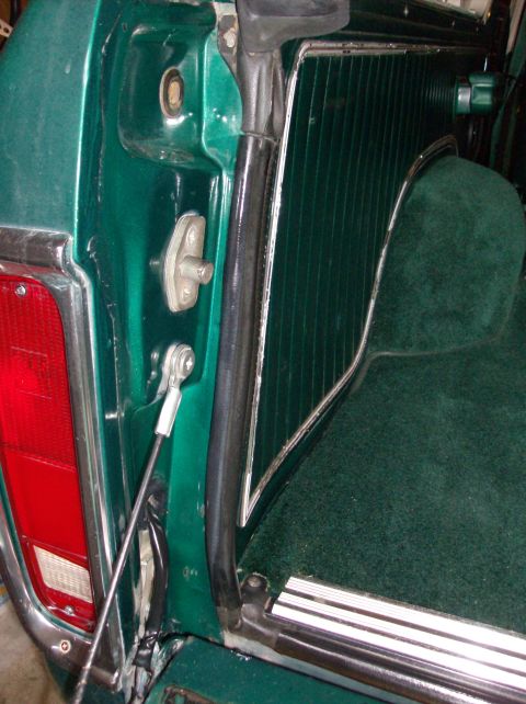 1978 Ford Bronco - Close-up of the interior panel and tailgate latch on a 1978 Ford Bronco.