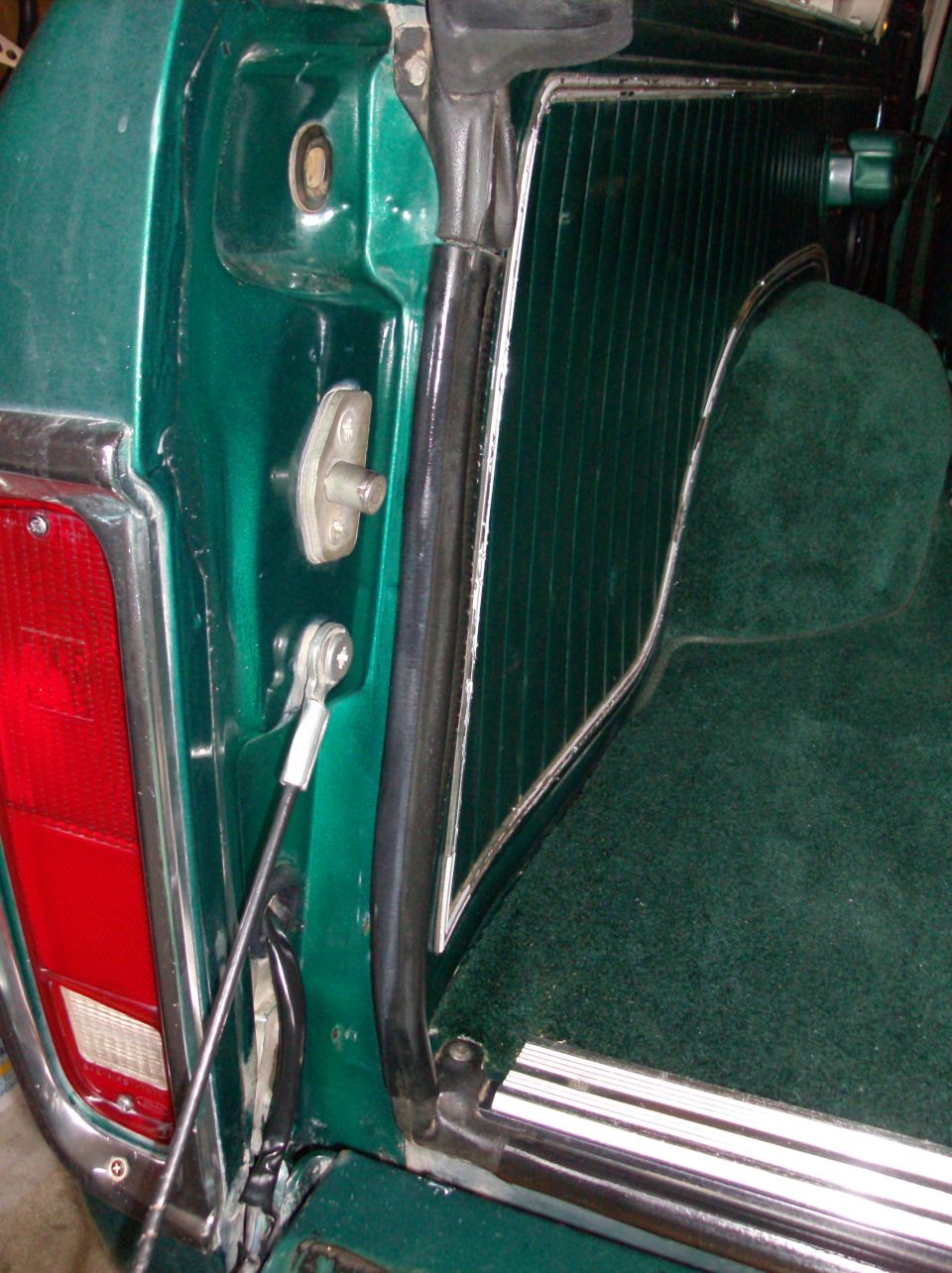 Green interior panel and tailgate latch mechanism of a 1978 Ford Bronco