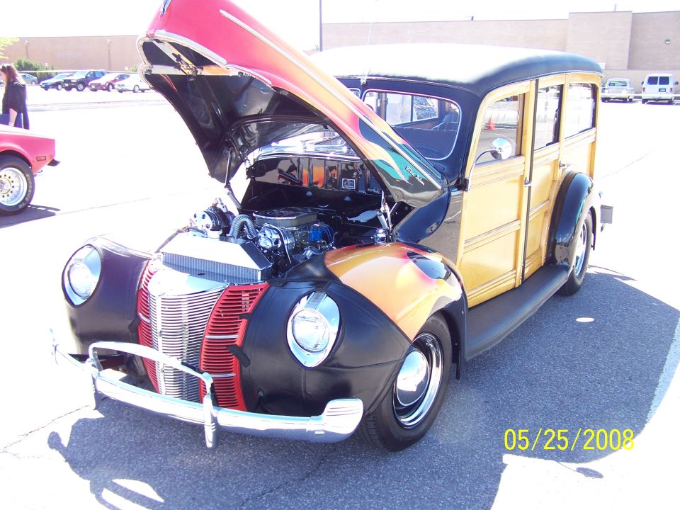 1940 Ford Woody Wagon with hood open, showing engine and flame paint on fenders