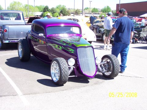 1972 Ford Ranchero - Custom hot rod coupe with flame graphics at a car show.