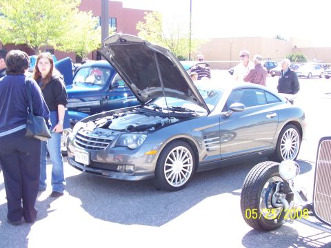 1972 Ford Ranchero - A gray coupe with its hood open is displayed at a car show, with other vehicles and people in the background. The date 05/25/2008 is visibl…