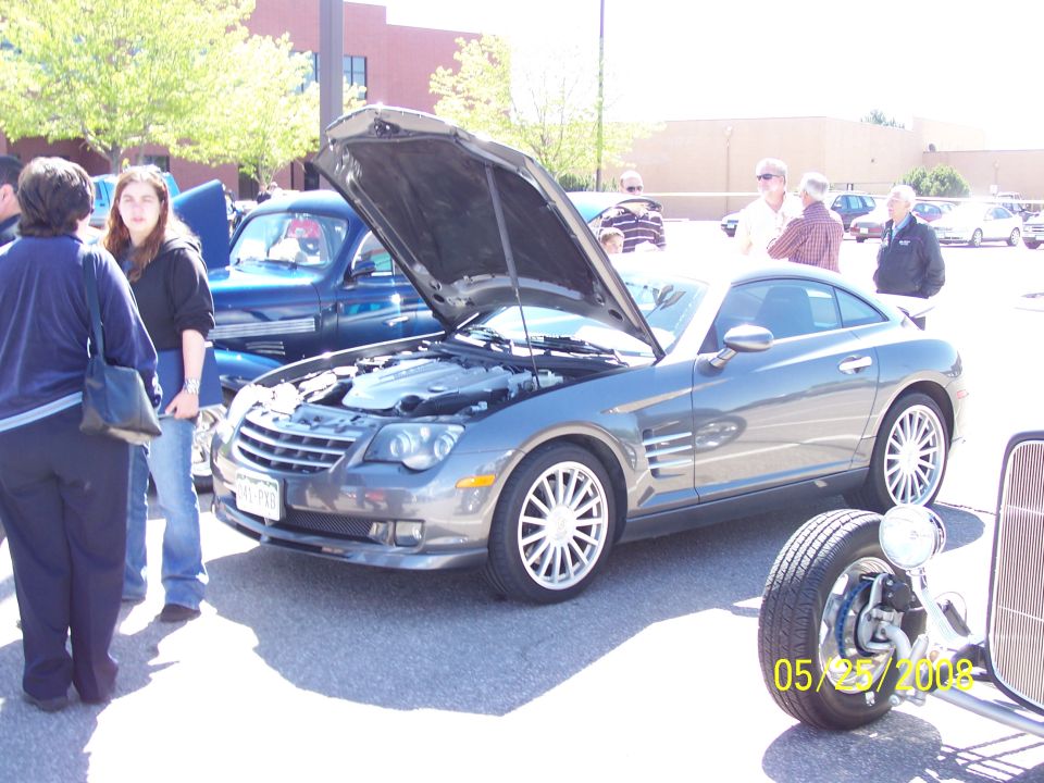 Gray coupe with hood open, showing engine. Date stamp 05/25/2008