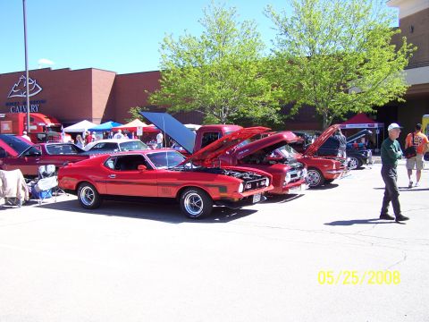 1972 Ford Ranchero - Several cars are displayed with their hoods open at an outdoor event on a sunny day.