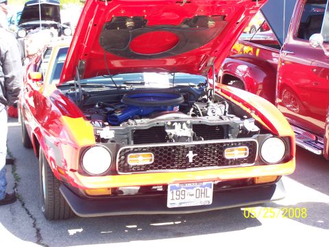 1972 Ford Ranchero - Front view of a 1971 Ford Mustang Mach 1 with its hood open, parked next to another red vehicle.