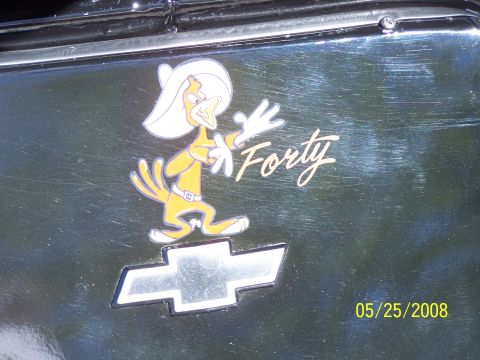 1972 Ford Ranchero - A Chevrolet emblem is visible on a black car panel, adorned with a cartoon duck sticker.