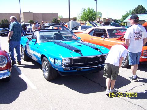 1972 Ford Ranchero - Blue 1970 Mustang convertible with black stripes and white side stripes at a car show.
