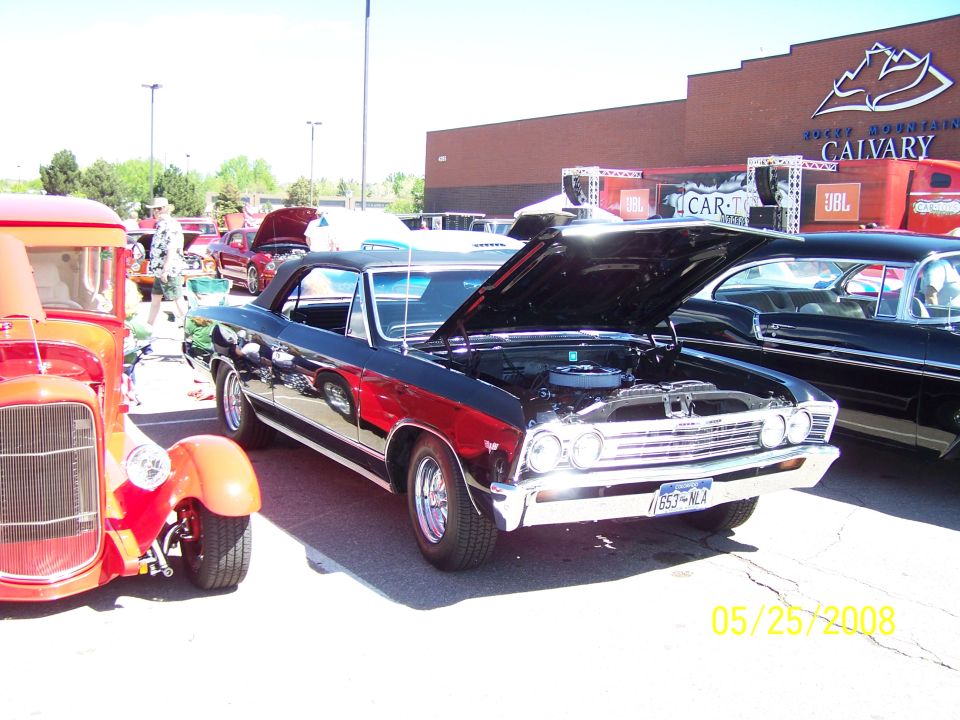 1967 Chevrolet Chevelle SS convertible with hood open, parked next to a red hot rod. Date stamp 05/25/2008