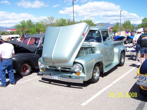 1972 Ford Ranchero - A light blue 1956 Ford F-series pickup truck is displayed with its hood open at an outdoor car show.