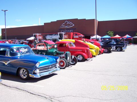 1972 Ford Ranchero - Several classic cars are lined up outside a building at the Rocky Mountain Calvary Car Show.