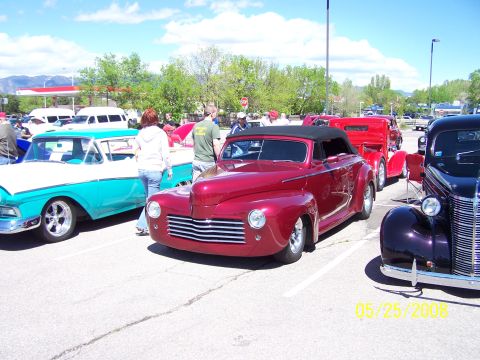 1972 Ford Ranchero - Several classic vehicles are on display at an outdoor car show on a sunny day.