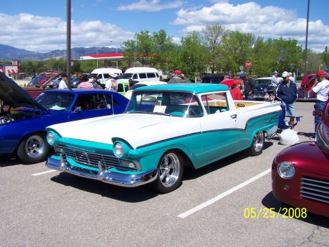 1972 Ford Ranchero - A classic two-tone pickup truck is displayed at an outdoor car show on a sunny day.