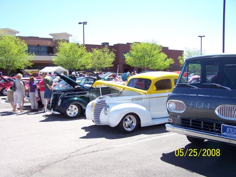 1972 Ford Ranchero - Ford Econoline van and other classic vehicles on display at a car show.