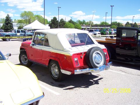 1972 Ford Ranchero - 1972 Jeep CJ-5 convertible parked at a car show with other vehicles present.