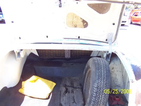 1972 Ford Ranchero - The trunk of a vehicle is shown, containing a spare tire and a yellow cloth. A date stamp indicates the photo was taken on 05/25/2009.