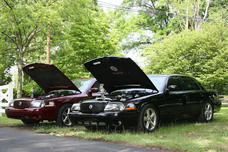 Two 2003 Mercury Marauders parked side-by-side with hoods open