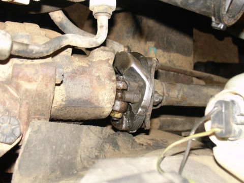 1978 Ford Bronco - This is a close-up view of a vehicle's steering linkage, showing wear and tear.
