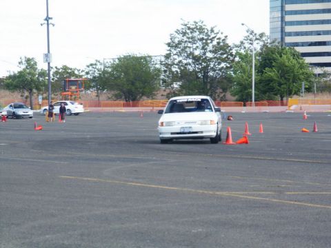 2001 Mercury Grand Marquis - A 2001 Mercury Grand Marquis participates in a timed driving event on a paved lot.