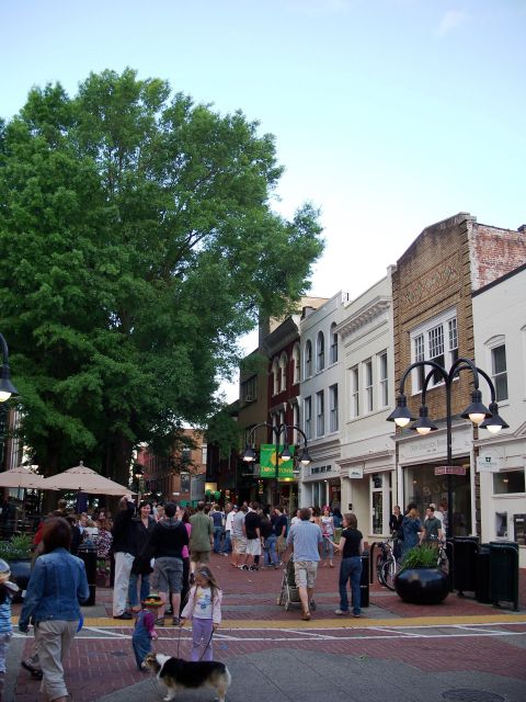1971 Ford Ranchero - A busy street scene with shops and people enjoying the outdoors.