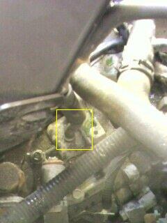 2002 Nissan SE-R - Close-up view of an engine vacuum line connection, with a yellow box highlighting a specific area. The Supermotors.net logo is present at t…