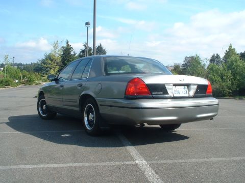 2000 Ford Crown Victoria - This 2000 Ford Crown Victoria is seen from the rear in a parking lot.