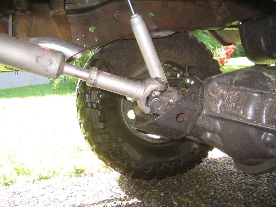 Rear axle, driveshaft, and exhaust of a 1979 Ford Bronco.