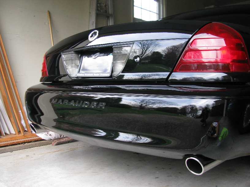 Black Mercury Marauder rear bumper with chrome exhaust tip and 'Marauder' text.
