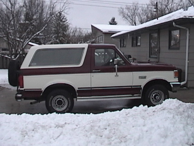 1991 Ford Bronco parked in snow