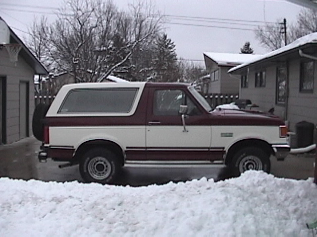 1991 Ford Bronco side view in snow