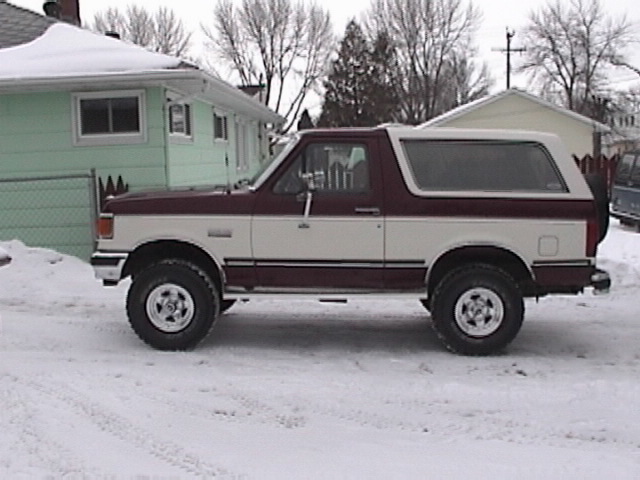 1991 Ford Bronco parked in snow