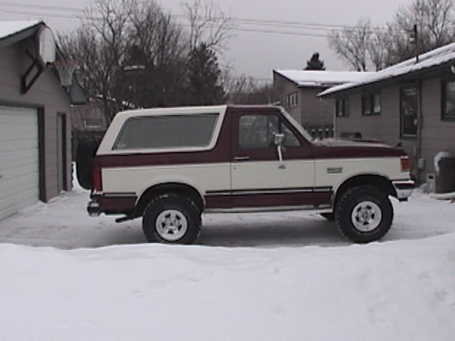 1991 Ford Bronco parked in snow