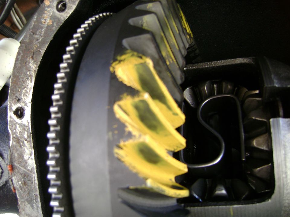 Close-up of differential gears with yellow marking compound applied