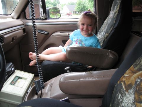 1994 Ford Bronco - A young girl smiles from the passenger seat of a 1992 Ford Bronco.