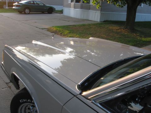 1988 Mercury Grand Marquis - The hood ornament and chrome trim are visible on this 1988 Mercury Grand Marquis.