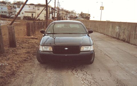 1999 Ford Crown Victoria - This 1998 Ford Crown Victoria is seen from the front in a street setting.