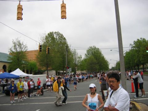 1985 Ford LTD Crown Victoria - A street scene during the Charlotte Half Marathon in 2008, with participants and onlookers.