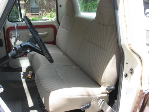 1972 Ford F-100 - Interior view of a 1972 Ford F-100, focusing on the bench seat and dashboard.