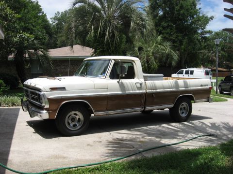 1972 Ford F-100 - This two-tone 1972 Ford F-100 pickup truck is shown from a 3/4 front angle.