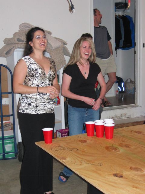 1985 Ford LTD Crown Victoria - Partygoers enjoy a game of beer pong indoors.