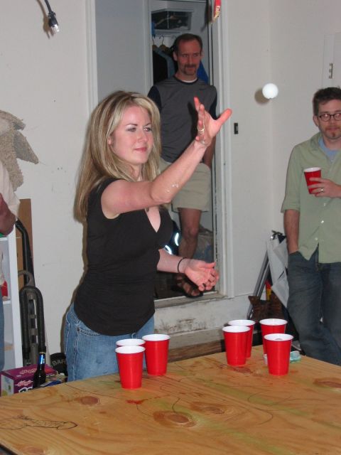 1985 Ford LTD Crown Victoria - People gathered for a game of beer pong indoors.