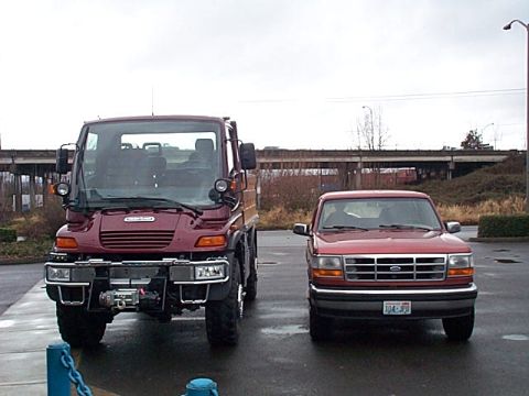 1996 Ford Bronco - My Dads 94 EB sitting next to a brand new Freightliner Unimog.