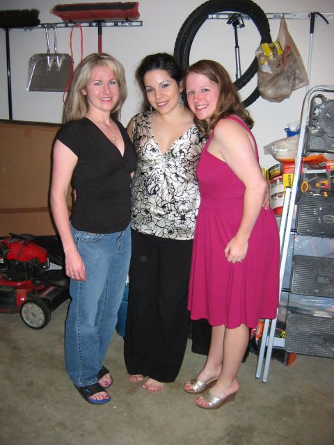 1985 Ford LTD Crown Victoria - Three women pose for a photo in a garage setting, with household items in the background.