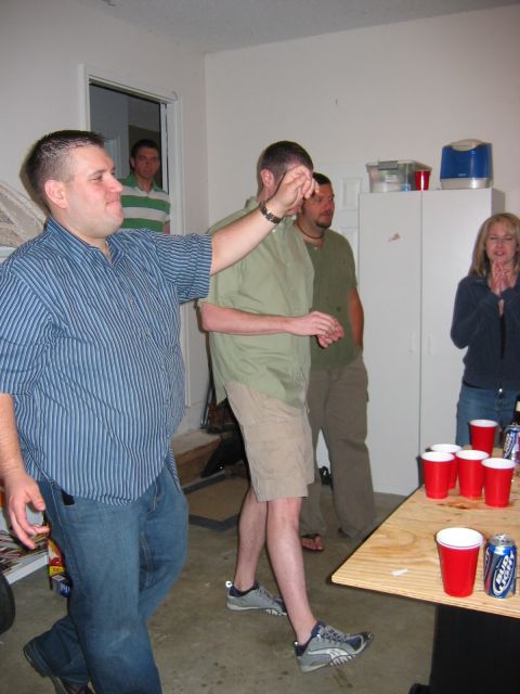 1985 Ford LTD Crown Victoria - Photo of people at a beer-pong party, not a technical document.