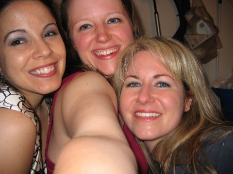 1985 Ford LTD Crown Victoria - Selfie of three women at a party, not a technical document.