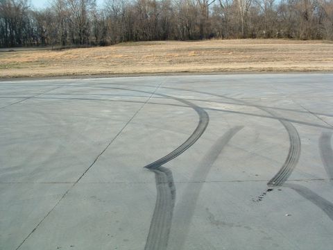 1995 Ford Crown Victoria - Tire marks on pavement with a Supermotors.net watermark in the corner.